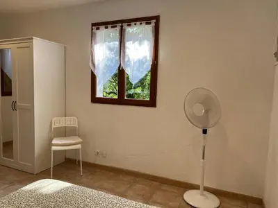 Un ou plusieurs lits dans un hébergement de l'établissement La Cigalière - Appartement Rez-de-Jardin