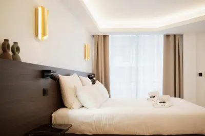 Un ou plusieurs lits dans un hébergement de l'établissement 2 Appartements porte à porte Groupe & famille