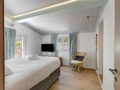Un ou plusieurs lits dans un hébergement de l'établissement Immogroom - Amazing Villa with sea view