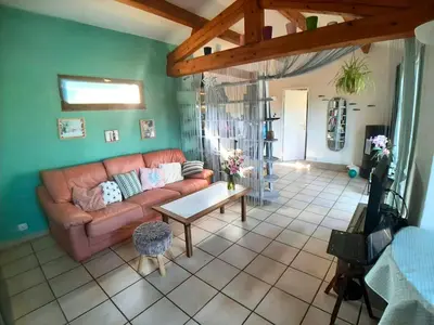 Coin salon dans l'établissement Charmante maison au calme