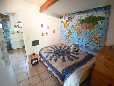 Un ou plusieurs lits dans un hébergement de l'établissement Charmante maison au calme