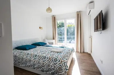 Un ou plusieurs lits dans un hébergement de l'établissement Appart 3 chambres - Les Lys