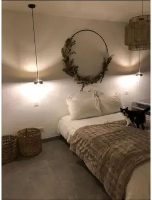 Un ou plusieurs lits dans un hébergement de l'établissement Appartement 200m de la plage
