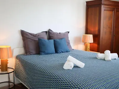 Un ou plusieurs lits dans un hébergement de l'établissement Apartment Le Lerins by Interhome