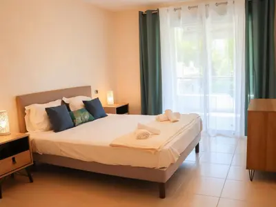 Un ou plusieurs lits dans un hébergement de l'établissement Apartment Cristal Croisette-5 by Interhome