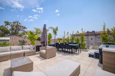 Coin salon dans l'établissement Appartement jacuzzi