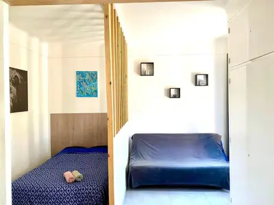 Un ou plusieurs lits dans un hébergement de l'établissement Appartement Le Central Park