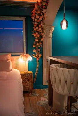 Un ou plusieurs lits dans un hébergement de l'établissement Le Boudoir