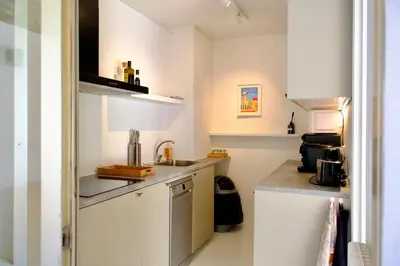 Cuisine ou kitchenette dans l'établissement Appartement de standing - quartier Martinez - 70m2