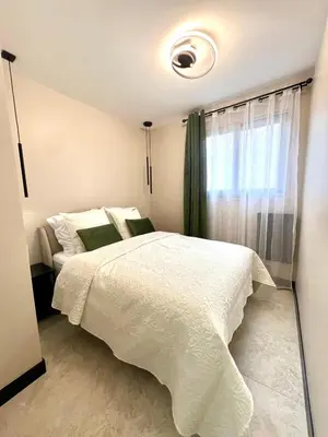 Un ou plusieurs lits dans un hébergement de l'établissement Appartement cosy proche de la Croisette