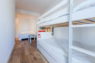 Un ou plusieurs lits dans un hébergement de l'établissement Résidence 90m2 Sur La Croisette Avec Terrasse & Vue Mer - 90m2 sur la Croisette avec terrasse & vue mer MAE-1963