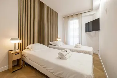 Un ou plusieurs lits dans un hébergement de l'établissement Elegant apt with balcony near the beaches – Cannes