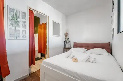 Un ou plusieurs lits dans un hébergement de l'établissement Appartement Les jardins de Vallauris - Welkeys