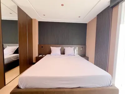 Un ou plusieurs lits dans un hébergement de l'établissement Croisette Luxury
