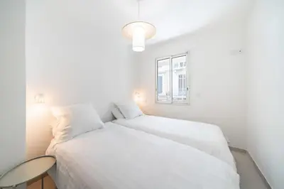 Un ou plusieurs lits dans un hébergement de l'établissement Chic appartement 2 pièces