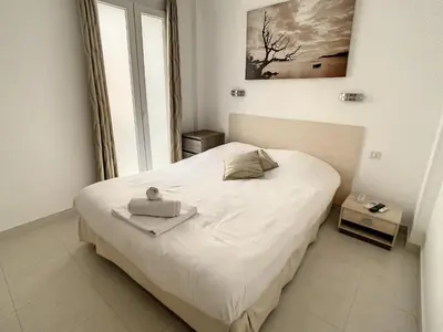 Un ou plusieurs lits dans un hébergement de l'établissement Luxueux appartements idéalement situés en plein centre ville de Cannes