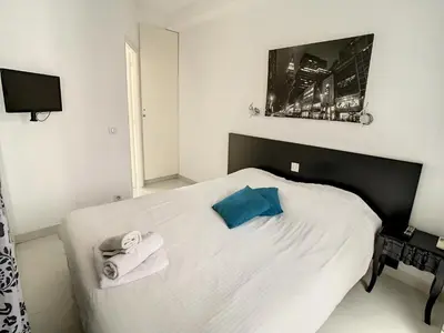 Un ou plusieurs lits dans un hébergement de l'établissement Luxueux appartements idéalement situés en plein centre ville de Cannes