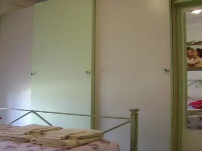 Un ou plusieurs lits dans un hébergement de l'établissement Apartment Boite d'Amour Wohnung mit Terrasse und Solarium by Interhome