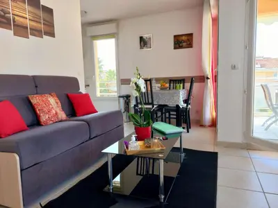 Coin salon dans l'établissement Apartment Die Gärten von Antibes by Interhome