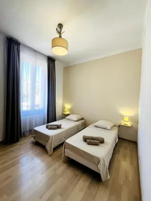 Un ou plusieurs lits dans un hébergement de l'établissement Appartement Calme Proche Plages