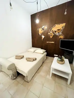 Un ou plusieurs lits dans un hébergement de l'établissement Appartement Calme Proche Plages