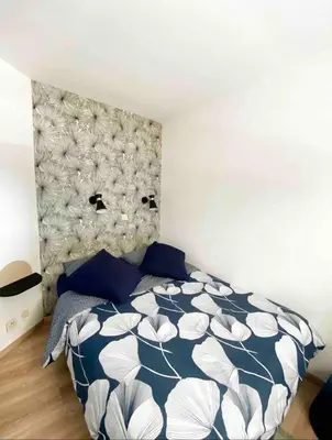 Un ou plusieurs lits dans un hébergement de l'établissement Appart cosy climatisé Marina Baie des Anges