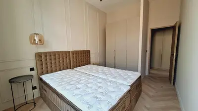 Un ou plusieurs lits dans un hébergement de l'établissement first louis marie Beautiful 3 bedrooms elegant and central