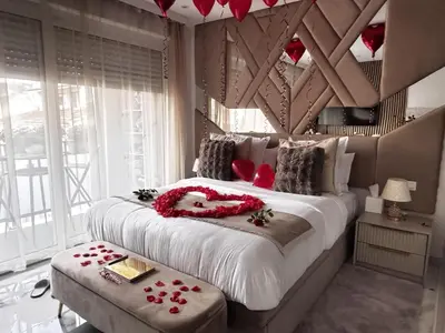 Un ou plusieurs lits dans un hébergement de l'établissement California Romantic Suite with Balneo
