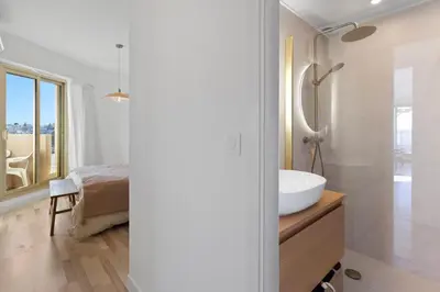 Un ou plusieurs lits dans un hébergement de l'établissement Le Rooftop - Jacuzzi - Mer - Terrasse 180 - Parking