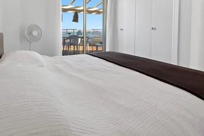 Un ou plusieurs lits dans un hébergement de l'établissement Le Rooftop - Jacuzzi - Mer - Terrasse 180 - Parking