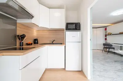 Cuisine ou kitchenette dans l'établissement Studio en Résidence de Standing Proche Centre