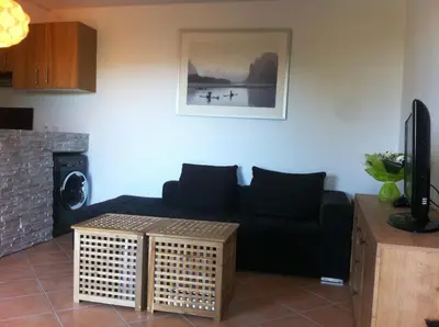 Coin salon dans l'établissement Comme une petite maison à la mer