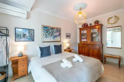 Un ou plusieurs lits dans un hébergement de l'établissement Villa Petit Cottage Cap d'Antibes