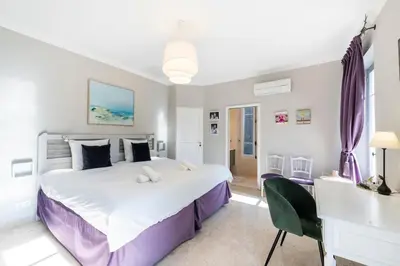 Un ou plusieurs lits dans un hébergement de l'établissement Villa Petit Cottage Cap d'Antibes