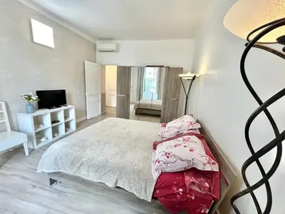Un ou plusieurs lits dans un hébergement de l'établissement Amiral Courbet Apartment