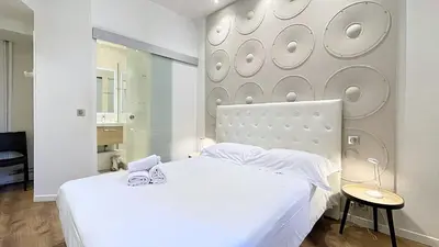 Un ou plusieurs lits dans un hébergement de l'établissement Hotel Le Florian