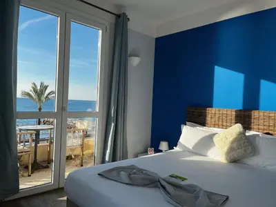 Un ou plusieurs lits dans un hébergement de l'établissement Hôtel du Bord de Mer 