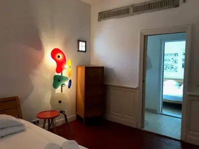 Un ou plusieurs lits dans un hébergement de l'établissement Hôtel de la Pinède