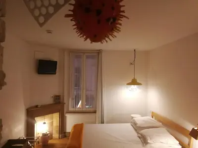 Un ou plusieurs lits dans un hébergement de l'établissement Hôtel de la Pinède