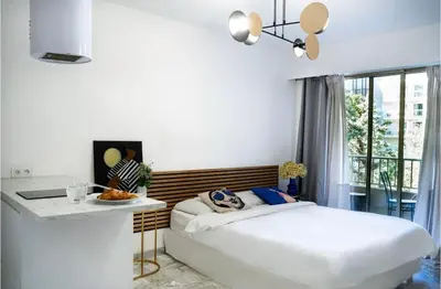 Un ou plusieurs lits dans un hébergement de l'établissement Majestic Apartment