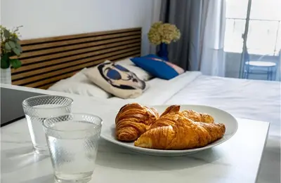 Un ou plusieurs lits dans un hébergement de l'établissement Majestic Apartment