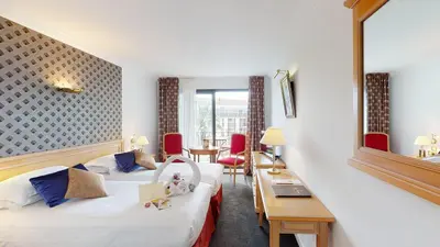 Un ou plusieurs lits dans un hébergement de l'établissement Sun Riviera Hotel