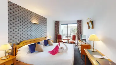 Un ou plusieurs lits dans un hébergement de l'établissement Sun Riviera Hotel