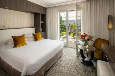 Un ou plusieurs lits dans un hébergement de l'établissement Hôtel Le Canberra