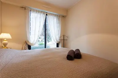 Un ou plusieurs lits dans un hébergement de l'établissement Carlton Riviera Apartment