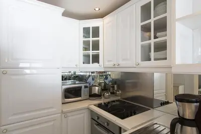 Cuisine ou kitchenette dans l'établissement Résidence Le Soleil