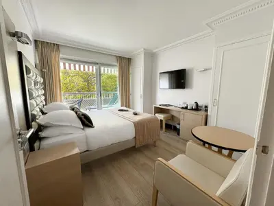 Un ou plusieurs lits dans un hébergement de l'établissement Hôtel Victoria
