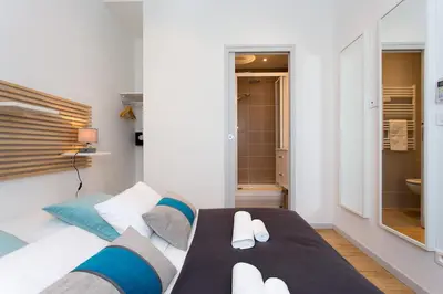 Un ou plusieurs lits dans un hébergement de l'établissement Teisseire Accomodations