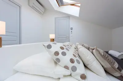 Un ou plusieurs lits dans un hébergement de l'établissement Teisseire Accomodations