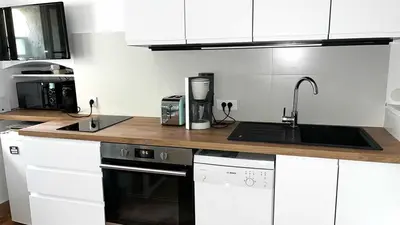 Cuisine ou kitchenette dans l'établissement Le rocher